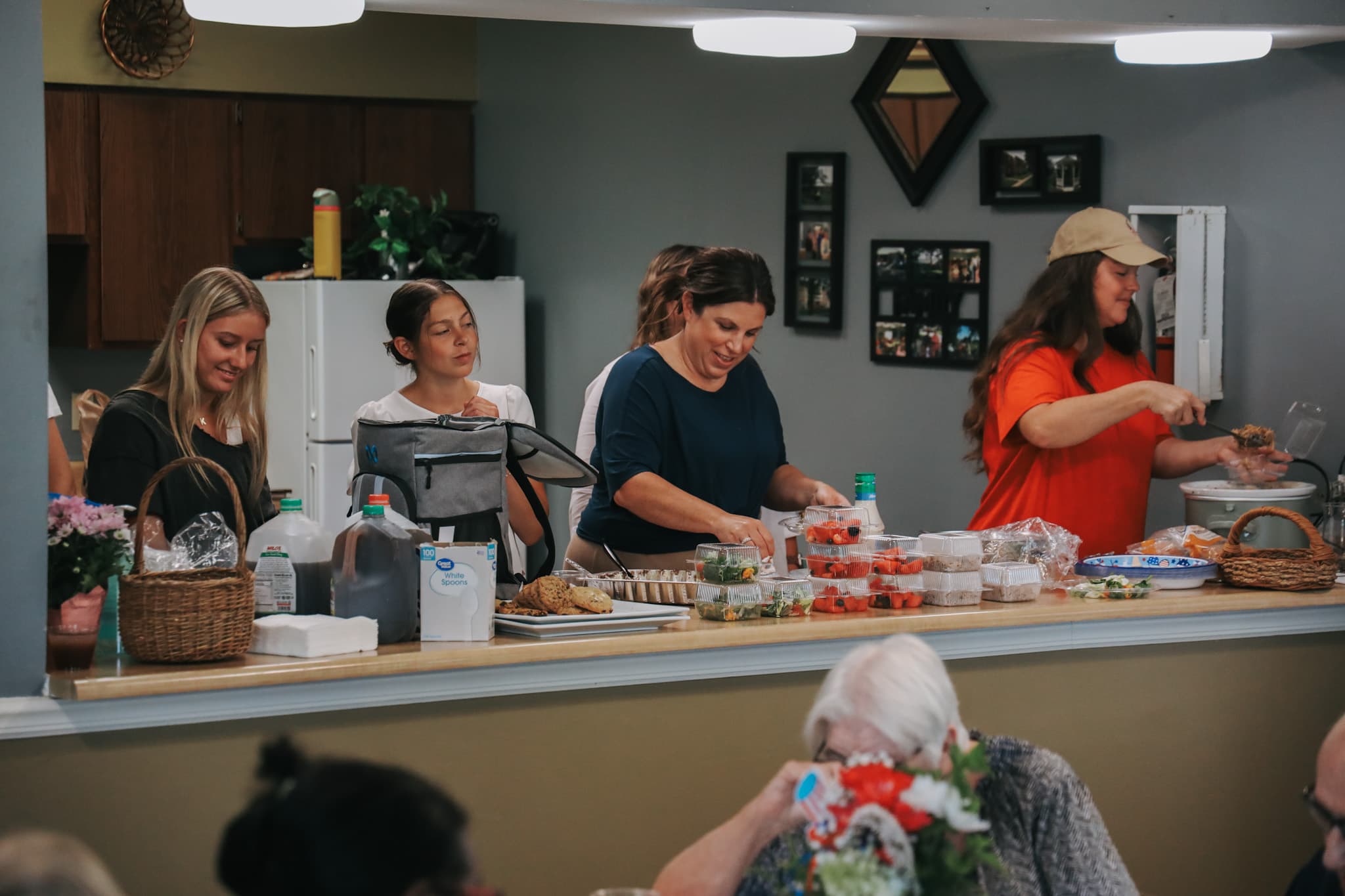 M25 Outreach volunteers serving families at community gathering in Franklin Indiana